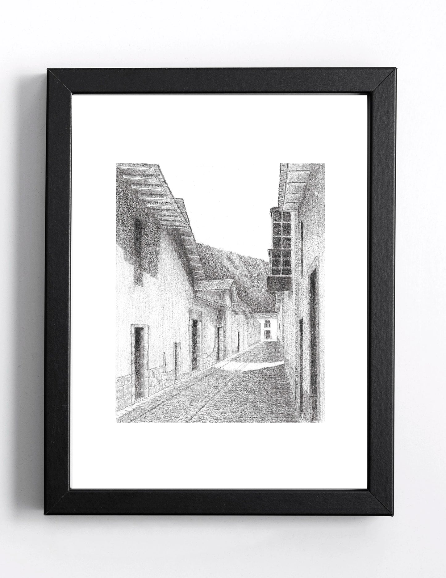 Mockup del barrio de San Blas en Cusco, imagen digital del dibujo arquitectónico en grafito, simulando enmarcado en negro con paspartú blanco.